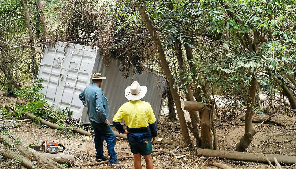 Property owner John Atherton with Gympie Sporting Clays Club treasurer Andrew Thew inspect the resting place of the missing shipping container, washed into Wide Bay Ck and then the Mary River. Property owner John Atherton with Gympie Sporting Clays Club treasurer Andrew Thew inspect the resting place of the missing shipping container, washed into Wide Bay Ck and then the Mary River.